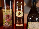 three bottles of wine sitting on a table next to each other