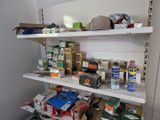 a shelf full of food and other items in a room
