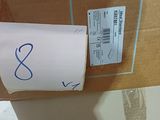 a box with a sticker on it sitting on a table