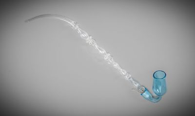 a glass pipe that is sitting on top of a table