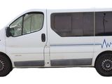 an image of a white van parked on the side of the road