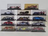 a lot of different models of cars in a display case