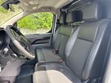 the interior of a car with a steering wheel and a dashboard