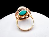 an image of a close up of a ring with a turquoise stone