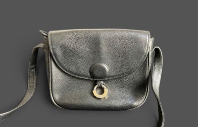 leather cross body bag with a metal buckle