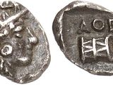 a silver coin with a picture of a man on it