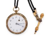 a close up of a pocket watch and a key on a necklace