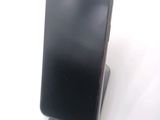 a cell phone that is sitting on top of a stand