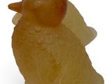 a figurine of a bird made of soap on a white surface