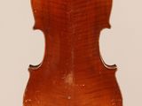 an old violin with a wooden back and a long neck