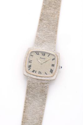an image of a wrist watch with roman numerals on it