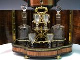 a wooden table with a glass set on top of it