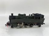 a toy train on a white surface with a white background