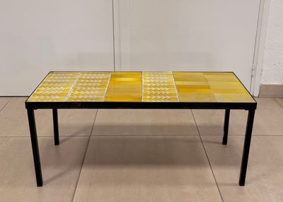 yellow and black tiled coffee table with black legs