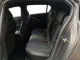 the back seats of a car with the door open and the driver ' s seat down