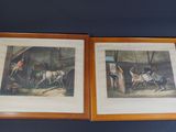 two framed prints of horses and riders in a stable