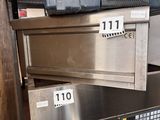 a stack of metal boxes on top of a metal shelf