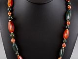 a close up of a necklace on a mannequin mannequin