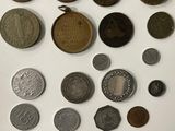 many different types of coins on the table