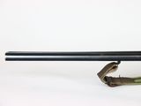 a close up of a rifle with a sling attached to it