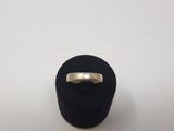 a close up of a silver ring on a black ring holder