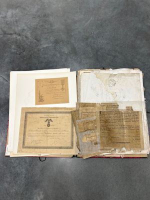 an open book sitting on top of a table next to a pair of scissors