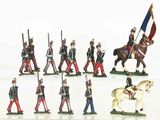 many figurines of soldiers on display on a white surface