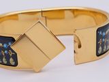 an image of a close up of a bracelet on a white surface
