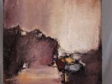 a painting that is sitting on a easel in a room
