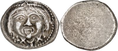 a silver coin with a face on the front and a face on the back