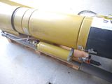 a yellow and black pipe attached to a yellow and black pipe