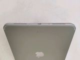 an apple laptop computer sitting on top of a white table