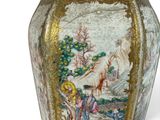 a vase with a picture of a woman and a man on it