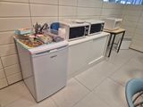 an image of a kitchen with microwaves and other appliances