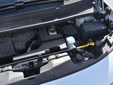 a car that has its hood open with the engine in it