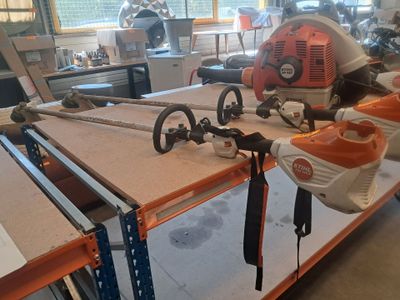a workbench with tools on it in a workshop