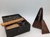 an old wooden box with a ruler and a ruler in it