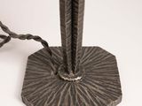 a close up of a metal object on a white surface