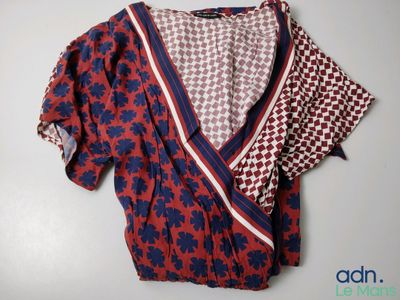 an image of a red and blue top with a pattern on it