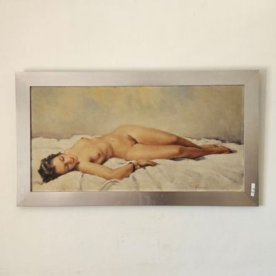 une peinture représentant une femme nue allongée sur un lit