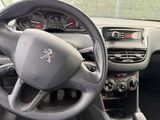 dashboard of a car with a steering wheel and dashboard gauges
