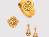 three pieces of gold jewellery including a ring, earrings and a ring
