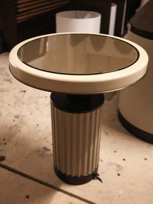 a small table with a mirror on top of it
