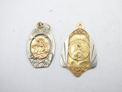 two gold and silver pendants with a picture of jesus
