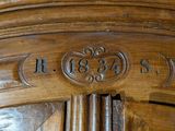 a close up of a wooden door with numbers on it