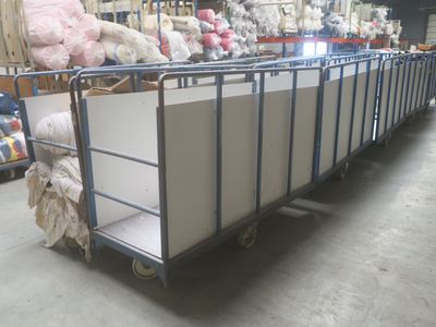 a metal cart with a bunch of stuffed animals on top of it
