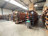 a large warehouse filled with lots of shelves and pallets
