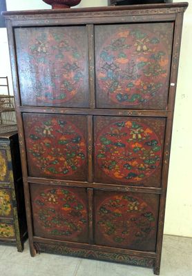 an image of a wooden cabinet with four drawers and a vase on top of it