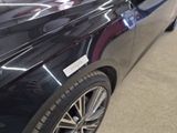 a picture of a car that has a sticker on it