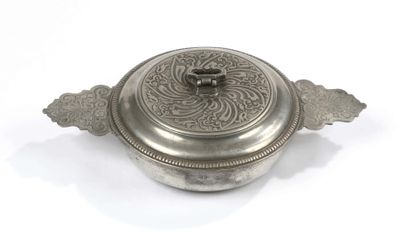 an old silver plate with a lid on a white background